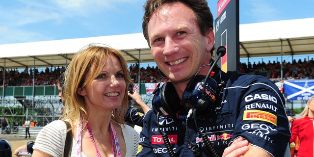 FILE - In this June 30, 2013 file photo Red Bull team principal Christian Horner and Geri Halliwell stand on the grid before the British Grand Prix at Silverstone Circuit, England. Halliwell, 42, says in a notice Tuesday Nov. 11, 2014 in the Times of London that she will wed Red Bull team principal Christian Horner, 40. The announcement did not say when the wedding is to take place. (AP Photo/PA, Anna Gowthorpe, File) UNITED KINGDOM OUT NO SALES NO ARCHIVE