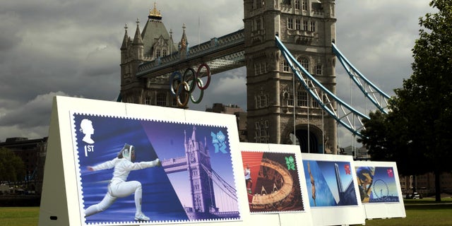 July 23, 2012: Enlarged images of Royal Mail's Welcome to the London 2012 Olympics stamps are displayed at Potters Fields, London .