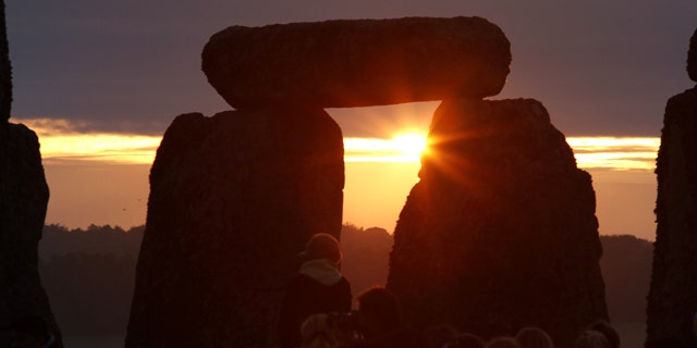 June 21, 2010: The sun rises behind the Stonehenge monument in England, during the summer solstice shortly after 04.52 am, Monday.