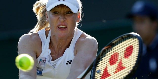 June 28, 2012: Elena Baltacha of Britain returns a shot to Petra Kvitova of the Czech Republic during a second round women's singles match at the All England Lawn Tennis Championships at Wimbledon, England. The former top-50 professional tennis player who had been fighting liver cancer since retiring from the game, died Sunday at age 30. (AP Photo/Kirsty Wigglesworth, File)