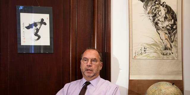 Oct. 17, 2014 - Dr. Peter Piot, the co-discoverer of the Ebola virus, speaks with The AP at his office at the London School of Hygiene and Tropical Medicine. Piot questioned why it took the World Health Organization 5 months and 1,000 deaths before the agency declared Ebola an international health emergency in August.