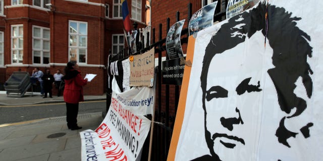Placards and messages placed by supporters of WikiLeaks founder Julian Assange, are seen outside the Ecuador Embassy, London, Friday, June 29, 2012. Assange had entered the embassy in an attempt to gain political asylum to prevent him from being extradited to Sweden to face allegations of sex crimes, which he denies. (AP Photo/Lefteris Pitarakis)