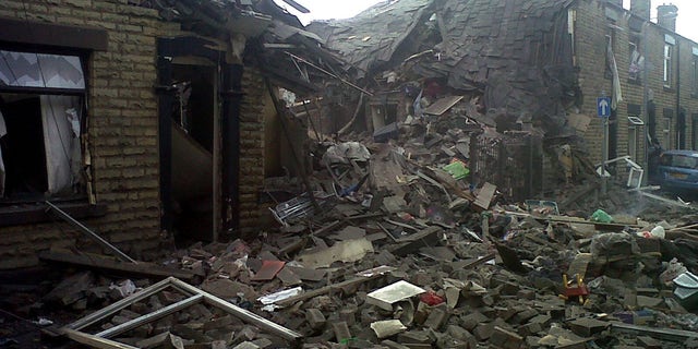 June 26, 2012: Damaged houses are seen at the scene of a suspected gas explosion in the Shaw area of Oldham England.