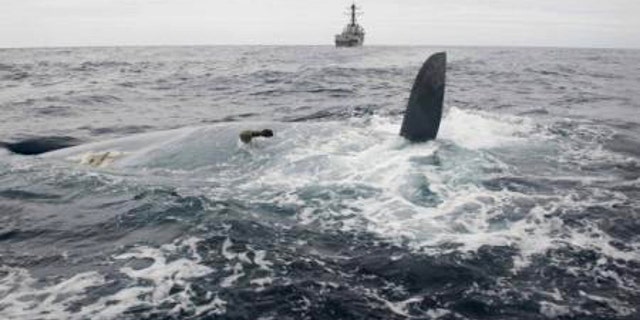 May 23, 2014: In this photo provided by the United States Navy, the overturned hull of the Cheeki Rafiki is shown as discovered by a U.S. Navy warship approximately 1,000 miles east of Cape Cod, Mass.