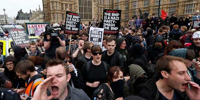 June 1, 2013: Anti-fascist demonstrators shout slogans against members of the British National Party (BNP) , not seen, who gathered for a demonstration in central London. British National Party supporters gathered to protest the May 22 killing of British soldier Lee Rigby.
