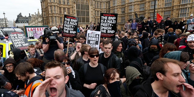 June 1, 2013: Anti-fascist demonstrators shout slogans against members of the British National Party (BNP) , not seen, who gathered for a demonstration in central London. British National Party supporters gathered to protest the May 22 killing of British soldier Lee Rigby.