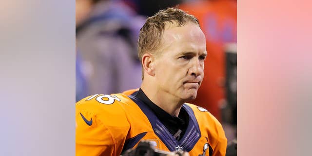 FILE - In this Feb. 2, 2014 file photo, Denver Broncos' Peyton Manning walks off the field after the NFL Super Bowl XLVIII football game against the Seattle Seahawks in East Rutherford, N.J. Manning delivers the keynote address at the Boy Scouts of America's annual breakfast Wednesday, April 16, 2014 in Denver, and makes his first public comments since the Denver Broncos were trounced by Seattle from the opening snap of the Super Bowl. (AP Photo/Chris O'Meara, File)