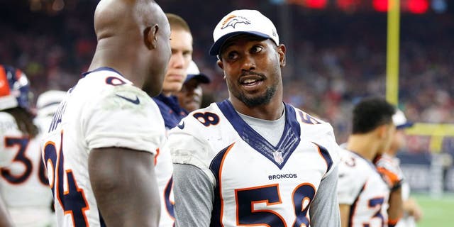 Aug 22, 2015; Houston, TX, USA; Denver Broncos linebacker Von Miller (58) talks with defensive end DeMarcus Ware (94) on the sidelines during the game against the Houston Texans at NRG Stadium. Mandatory Credit: Matthew Emmons-USA TODAY Sports