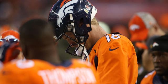 Nov 15, 2015; Denver, CO, USA; Denver Broncos quarterback Peyton Manning (18) reacts on the sidelines during the second half against the Kansas City Chiefs at Sports Authority Field at Mile High. The Chiefs won 29-13. Mandatory Credit: Chris Humphreys-USA TODAY Sports