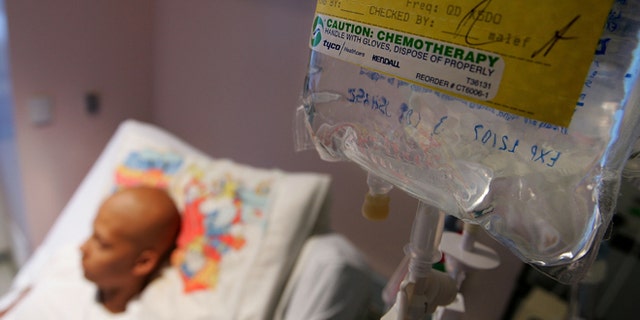 SAN FRANCISCO - AUGUST 18: Eighteen-year-old cancer patient Patrick McGill lies in his hospital bed while receiving IV chemotherapy treatment for a rare form of cancer at the UCSF Comprehensive Cancer Center Childrens Hospital August 18, 2005 in San Francisco, California. The UCSF Comprehensive Cancer Center continues to use the latest research and technology to battle cancer and was recently rated 16th best cancer center in the nation by US News and World Report. (Photo by Justin Sullivan/Getty Images)