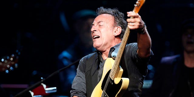 Bruce Springsteen and the E Street Band perform onstage during SiriusXM's 10th anniversary celebration at the Apollo Theater in Harlem, New York March 9, 2012. REUTERS/Carlo Allegri (UNITED STATES - Tags: ENTERTAINMENT)