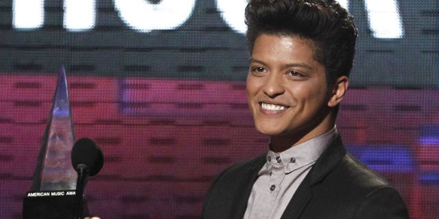 November 20, 2011: Bruno Mars accepts the award for pop/rock favorite male artist at the 39th Annual American Music Awards in Los Angeles.