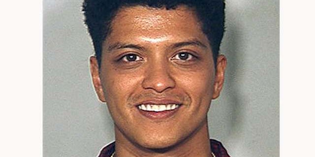 FILE - This Sept. 19, 2010 file image provided by the Las Vegas Metro Police Dept., shows singer Bruno Mars in a booking photo at the Clark County Detention Center in Las Vegas. Mars agreed Friday Jan. 28, 2011 to a plea deal that would get him a fine, probation and eventual dismissal of a felony cocaine possession charge.(AP Photo/Las Vegas Metro Police Department, File)