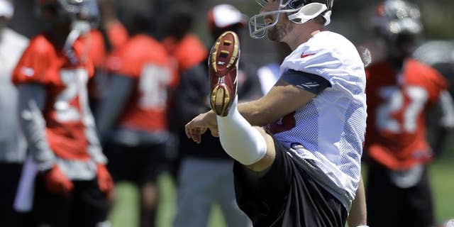 In this April 23, 2014 photo, Tampa Bay Buccaneers' Connor Barth follows through on a kick during a voluntary minicamp NFL football practice in Tampa, Fla. Barth never doubted he'd kick again for the Tampa Bay Buccaneers. The sixth-year pro missed all of last season after rupturing the Achilles tendon in his right foot during a charity basketball game, and he's confident he'll return as good as ever in 2014. (AP Photo)