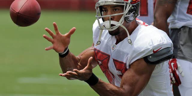 FILE - In this July 28, 2014 file photo, Tampa Bay Buccaneers wide receiver Vincent Jackson catches a pass during an NFL football training camp in Tampa, Fla. Jackson says he's about winning, and he believes the Bucs are ready to do more of that. (AP Photo/Chris O'Meara, File)