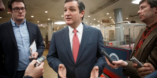 Sen. Ted Cruz, R-Texas, speaks with reporters as he arrives at the Capitol for the Senate vote to approve a $1.1 trillion spending package, the Omnibus Appropriations Act, a bipartisan compromise that all but banishes the likelihood of an election-year government shutdown, at the Capitol in Washington, Thursday, Jan. 16, 2014. The legislation is a follow-up to the budget compromise the two parties pushed through Congress in December that set overall spending limits for the next two years. (AP Photo/J. Scott Applewhite)