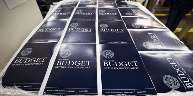 Copies of President Obama's proposed federal budget plan for fiscal year 2014 are prepared for delivery at the U.S. Government Printing Office.