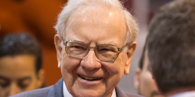 FILE - In this May 2, 2015, file photo, Berkshire Hathaway Chairman and CEO Warren Buffett smiles while touring the exhibit floor before presiding over the annual shareholders meeting in Omaha, Neb.