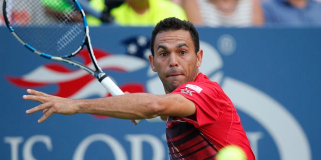 Victor Estrella Burgos, of the Dominican Republic, returns the ball during his first-round match against Jack Sock, of the United States, at the U.S. Open tennis tournament in New York, Tuesday, Sept. 1, 2015. (AP Photo/Kathy Willens)