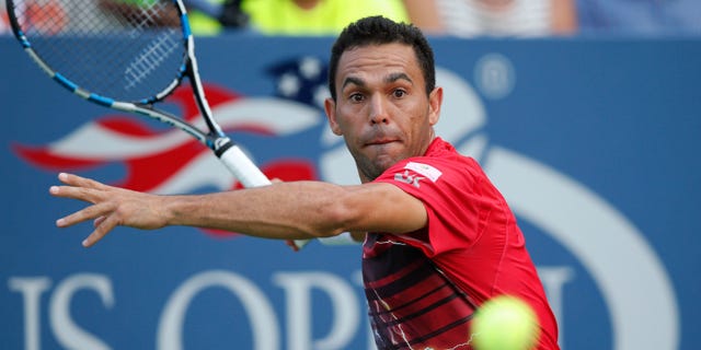 Victor Estrella Burgos, of the Dominican Republic, returns the ball during his first-round match against Jack Sock, of the United States, at the U.S. Open tennis tournament in New York, Tuesday, Sept. 1, 2015. (AP Photo/Kathy Willens)
