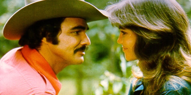 1977: Actors Burt Reynolds and Sally Field in the film 'Smokey and the Bandit'. (Photo by Michael Ochs Archives/Getty Images)