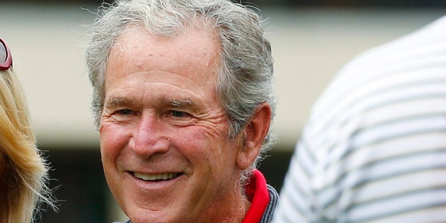 October 3, 2013: Former U.S. President George W. Bush at Muirfield Village Golf Club in Dublin, Ohio.