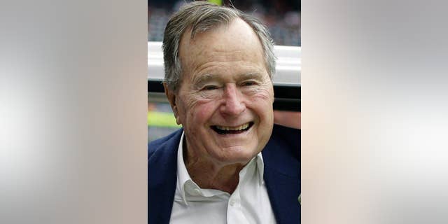 FILE - In this Nov. 4, 2012 file photo, former president George H.W. Bush pauses for a photo before an NFL football game in Houston between the Buffalo Bills and the Houston Texans. Former President George H.W. Bush is celebrating his 90th birthday in Maine. Thursday June 12, 2014. A family spokesman says a private dinner Thursday evening features a guest list of more than 200 friends and relatives. (AP Photo/Eric Gay, File)