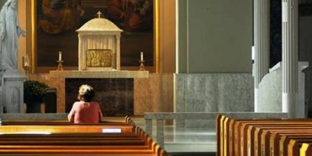 A survey shows nearly half of Americans worry about their religious rights. (Butch Comegys/The Times & Tribune via AP)