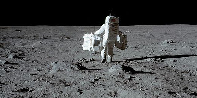 Apollo astronaut Buzz Aldrin collects moon rocks in 1969.