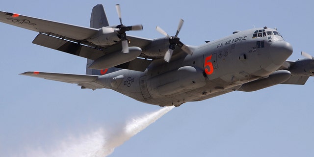 FILE 2009: Colorado Reserve C-130 drops water on a target during a certification flight at the Tucson International Airport.