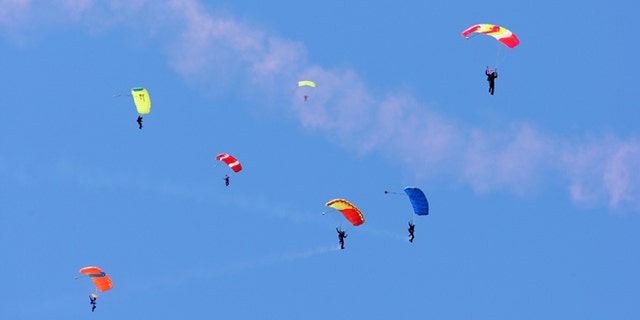 SAN FRANCISCO - AUGUST 05: Skydivers land at Marina Green for the largest aerial skydive ever performed in San Francisco, in celebration of the launch of the T-Mobile myTouch 3G phone with Google on August 5, 2009 in San Francisco, California. (Photo by John Shearer/Getty Images for T-Mobile)