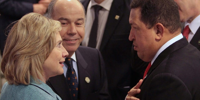 Jan. 1, 2011: U.S. Secretary of State Hillary Clinton speaks with Venezuela's President Hugo Chavez during the swearing-in ceremony of Brazil's President Dilma Rousseff