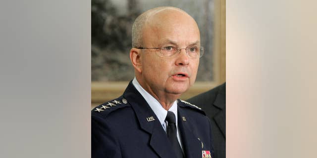 FILE - In this May 8, 2006 file photo, then-Air Force Gen. Michael Hayden speaks in the Oval Office at the White House in Washington after President Bush announced he was his choice to replace outgoing CIA Director Porter Goss. The head of the CIA during President George W. Bush’s second term says “I didn’t lie” to Congress about harsh interrogations of terrorism suspects. Retired Gen. Michael Hayden does say the intelligence community labored after Sept. 11, 2001 to repel further attacks against the U.S.  (AP Photo/Ron Edmonds, File)