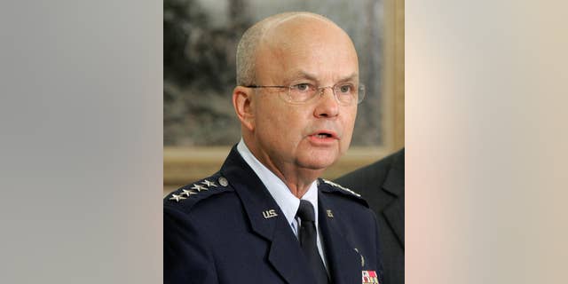 FILE - In this May 8, 2006 file photo, then-Air Force Gen. Michael Hayden speaks in the Oval Office at the White House in Washington after President Bush announced he was his choice to replace outgoing CIA Director Porter Goss. The head of the CIA during President George W. Bush’s second term says “I didn’t lie” to Congress about harsh interrogations of terrorism suspects. Retired Gen. Michael Hayden does say the intelligence community labored after Sept. 11, 2001 to repel further attacks against the U.S. (AP Photo/Ron Edmonds, File)