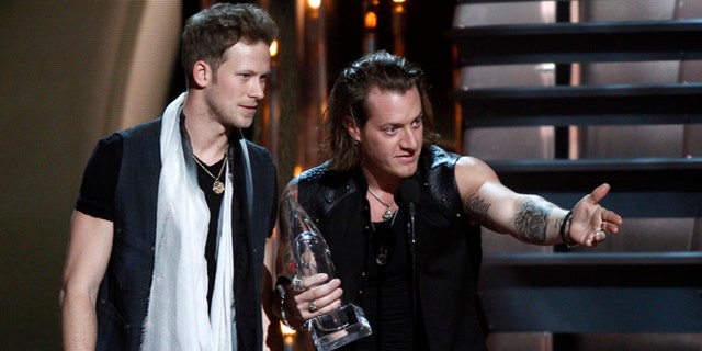 Nov. 6, 2013: Brian Kelley, left, and Tyler Hubbard, of Florida Georgia Line, accept the award for vocal duo of the year at the 47th annual CMA Awards at Bridgestone Arena in Nashville, Tenn.