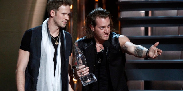 Nov. 6, 2013: Brian Kelley, left, and Tyler Hubbard, of Florida Georgia Line, accept the award for vocal duo of the year at the 47th annual CMA Awards at Bridgestone Arena in Nashville, Tenn.