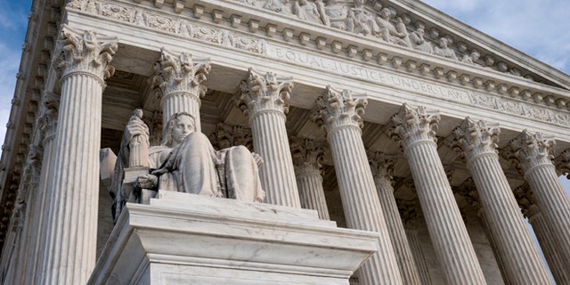 FILE - The Supreme Court in this Feb. 17, 2016 file photo. The Supreme Court is hearing an appeal from Colorado that claims a jurors ethnic slurs during deliberations were so offensive that they deprived the defendant of a fair trial. (AP Photo/J. Scott Applewhite)