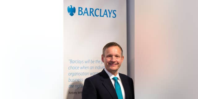 CORRECTS YEAR IMAGE WAS TAKEN TO 2013, NOT 2015 - FILE - In this April 25, 2013, file photo, Antony Jenkins, CEO of Barclays Bank, poses for photographers in London prior to the bank's annual general meeting. Barclays PLC fired chief executive Antony Jenkins on Wednesday, July 8, 2015, concluding he wasn't moving quickly enough to put past scandals behind the bank and increase profits. The bank, Britain's second largest, announced that John MacFarlane had taken over as executive chairman. (AP Photo/Alastair Grant, File)