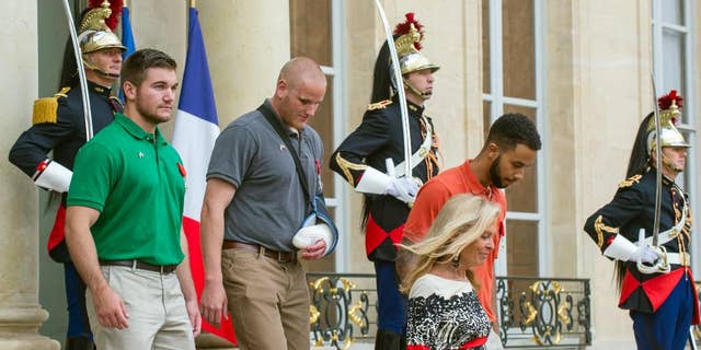 Alek Skarlatos, left, U.S. Airman Spencer Stone, second left, and Anthony Sadler, right, a senior at Sacramento State University, were awarded the French Legion of Honor for stopping the would-be attacker in 2015.