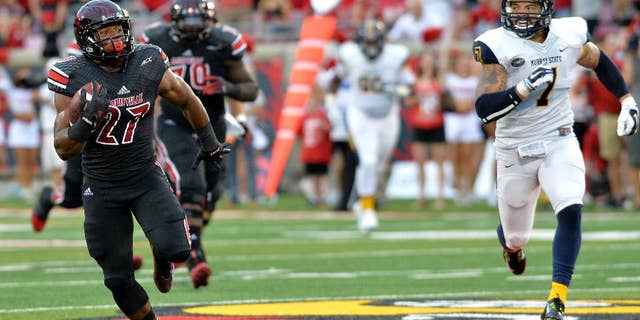 CORRECTS ID TO L.J. SCOTT, NOT GREG WILLARD - Louisville's L.J. Scott, left, outruns the pursuit of Murray State's Anthony Hayes during the second quarter of their NCAA college football game Saturday, Sep. 6, 2014 at Papa John's Cardinal Stadium in Louisville, Ky. (AP Photo/Timothy D. Easley)