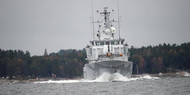 CORRECTS YEAR - The Swedish minesweeper HMS Kullen under way in Namdo Bay, Sweden, Tuesday, Oct. 21, 2014 on their fifth day of searching for a suspected foreign vessel in the Stockholm archipelago. The navy has demanded a 1000-meter, (yard) no-go radius around naval vessels taking part in the current operation. (AP Photo/Fredrik Sandberg) SWEDEN OUT