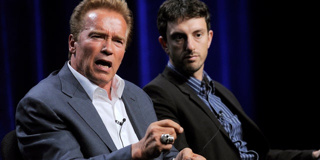 Aug. 3, 2012: Former California Gov. Arnold Schwarzenegger, left, the subject of a forthcoming ESPN short film, answers a question as the film's co-director Michael Zimbalist looks on during the ESPN Films "30 for 30 Shorts" TCA panel discussion at the Beverly Hilton hotel in Beverly Hills, Calif.