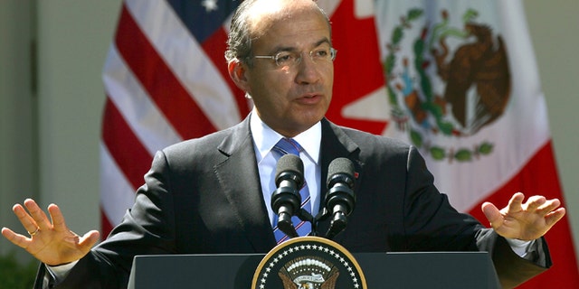 WASHINGTON, DC - APRIL 02: Mexican President Felipe Calderon answers a question during a joint press conference with U.S. President Barack Obama and Canadian Prime Minister Stephen Harper in the Rose Garden of the White House April 2, 2012 in Washington, DC. Obama hosted his counterparts from Canada and Mexico for the North American Leaders' Summit (NALS) with talks on cooperation among the three countries. (Photo by Win McNamee/Getty Images)