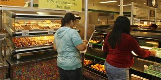 Students have a nutrition break mid-morning consisting of milk, juice, an orange and either mini sausage roll or Vegetarian Italian bagel at Belmont High School in Los Angeles, Cali.