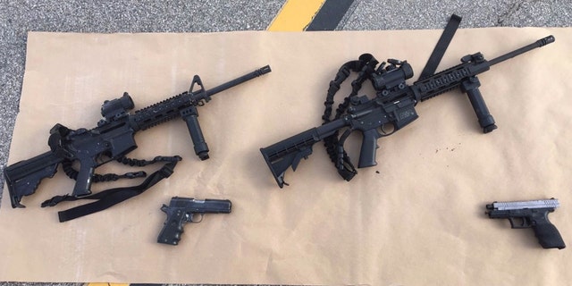 This photo provided by the San Bernardino County Sheriff's Department shows weapons carried by suspects at the scene of a shootout in San Bernardino, Calif. Multiple attackers opened fire on a banquet at a social services center for the disabled in San Bernardino on Wednesday, Dec. 2, 2015, killing multiple people and sending police on a manhunt for suspects. (San Bernardino County Sheriff's Department via AP)