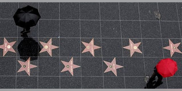 Dec. 20: Tourists walk on the Hollywood Walk of Fame in the Hollywood section of Los Angeles.