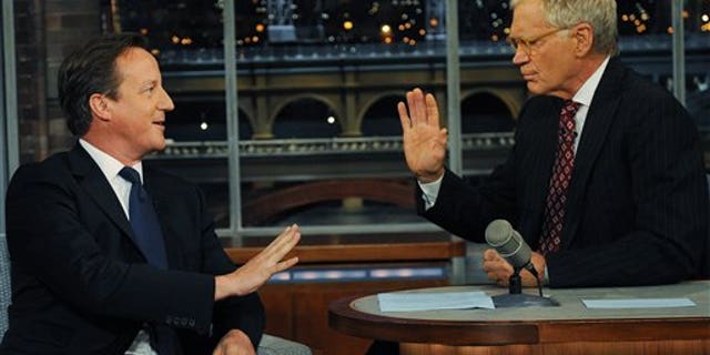 Sept. 26, 2012: Britain's Prime Minister David Cameron (left) talks with talk show host David Letterman on the David Letterman Show after he addressed the United Nations General Assembly, in New York.