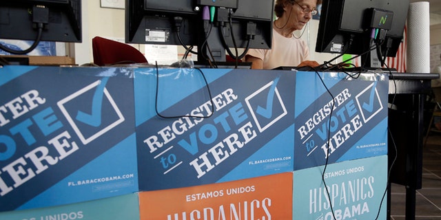 FILE - In this Oct. 8, 2012, file photo, a campaign volunteer inputs voter registration data into a computer at a campaign office for President Barack Obama, Monday, Oct. 8, 2012 in Miami. The vaunted data-driven machine that twice got Obama elected is dusting itself off to help elect Hillary Clinton, as Democrats look to recreate the tactical advantage they used against Republicans in 2008 and 2012.(AP Photo/Lynne Sladky, file)