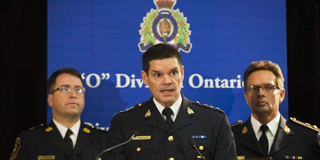 December 1, 2013: Chief Superintendent Larry Tremblay, Director General of the RCMP Federal Policing Criminal Operations of the RCMP, speaks during a news conference in Toronto. Police said that a Canadian man has been arrested for allegedly trying to sell classified information to the Chinese government about Canada's warship building procurement strategy. (AP Photo/The Canadian Press, Aaron Vincent Elkaim)