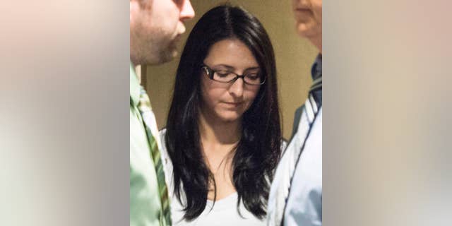 In a Tuesday, June 3, 2014 photo, Emma Czornobaj is pictured at the Montreal Courthouse in Montreal. Czornobaj, who stopped to help a group of ducklings on the side of the road, was found guilty Friday, June 20, 2014, of causing the deaths of a motorcyclist and his passenger daughter who slammed into her parked car on on June 27, 2010. (AP Photo/The Canadian Press, Graham Hughes)